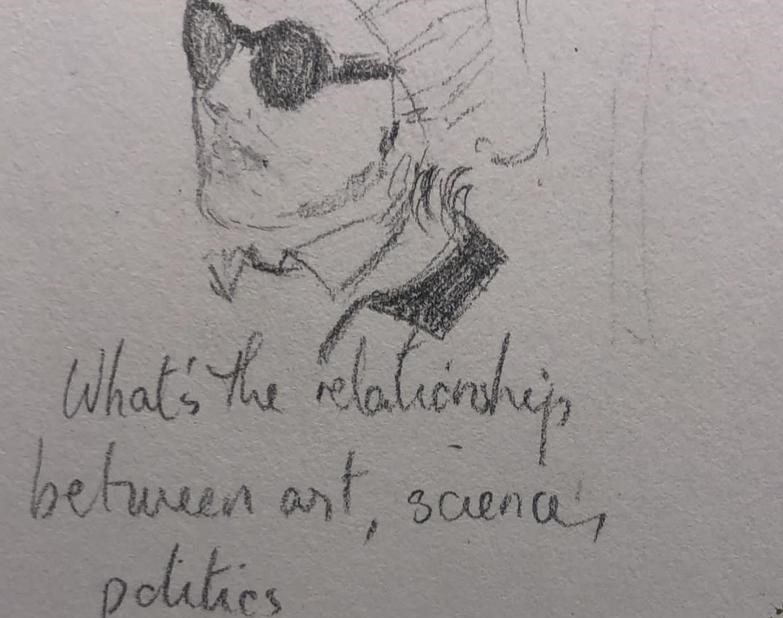 A sketch of a person's face, floppy hat, and collars. The person wears large round sunglasses. Under the sketch the words "What's the relationship between art, science, politics," no question mark. 