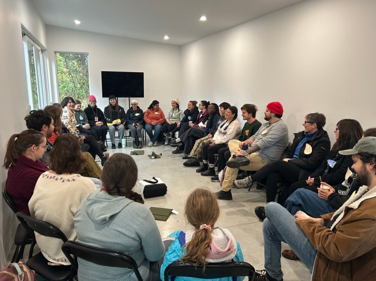 A group of people sitting in Woodhaven studio