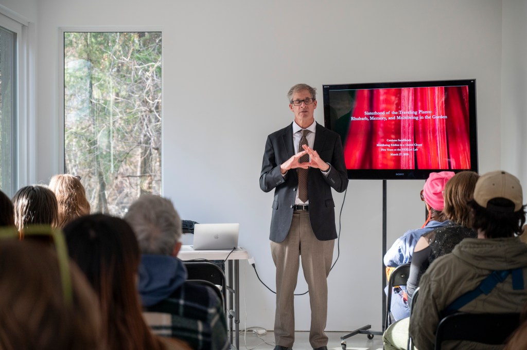 Introductions to cate talk in front of a fully packed audience in Woodhaven Studio