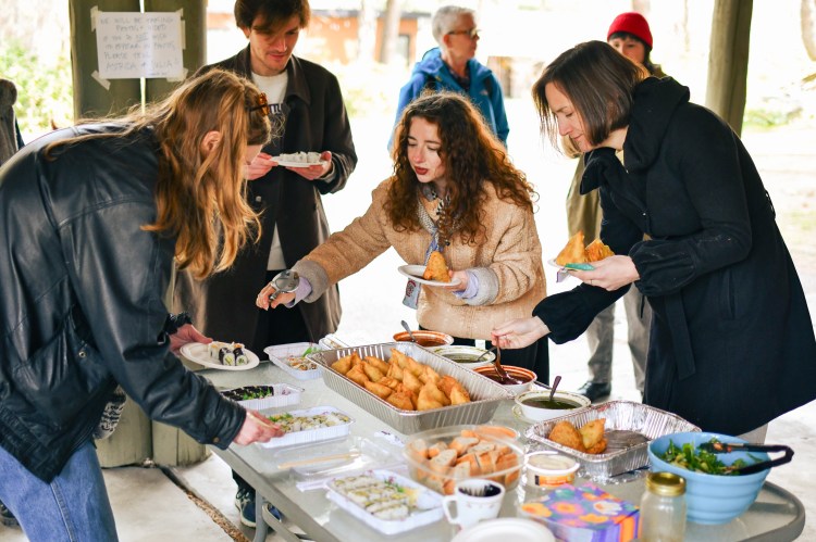 people picking up community lunch