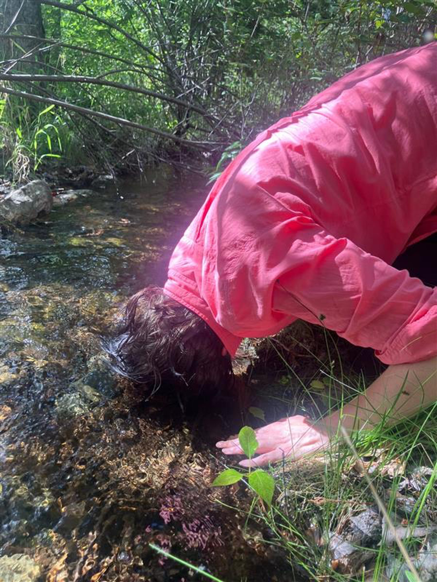 Photo credit: Astrida. Rhona dunking and merging her head with the creek